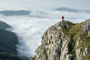 "Man reaching The Summit" image