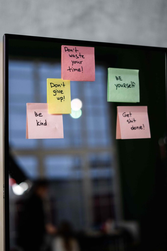 Sticky notes on a laptop with motivating messages motivate your team