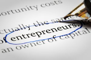 Pen rings the word entrepreneurs. Pen rings the word entrepreneurs.